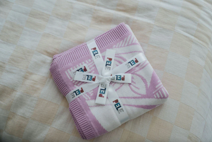 Couverture tricotée Alofa Afiafi avec le bonnet à pompon assorti