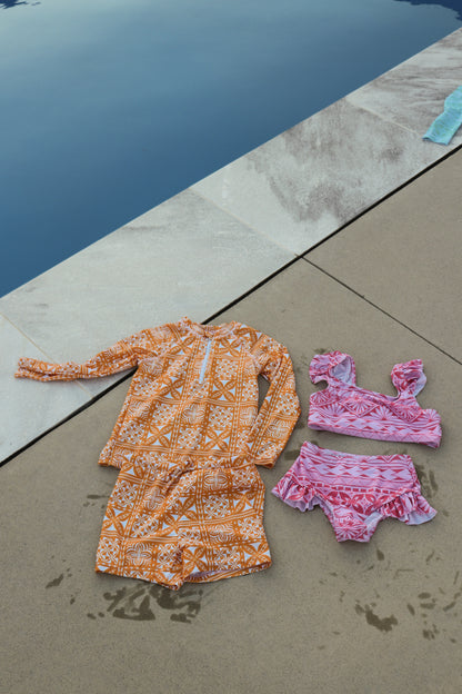 Maillots de bain anti-UV deux pièces bébé orange et rose aux motifs polynésiens